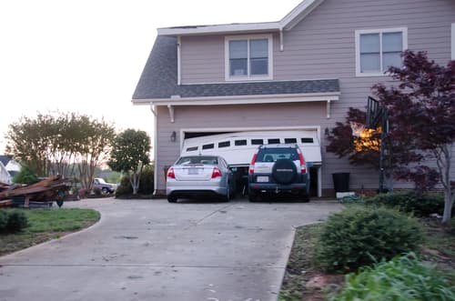 What are the common signs of a broken garage door